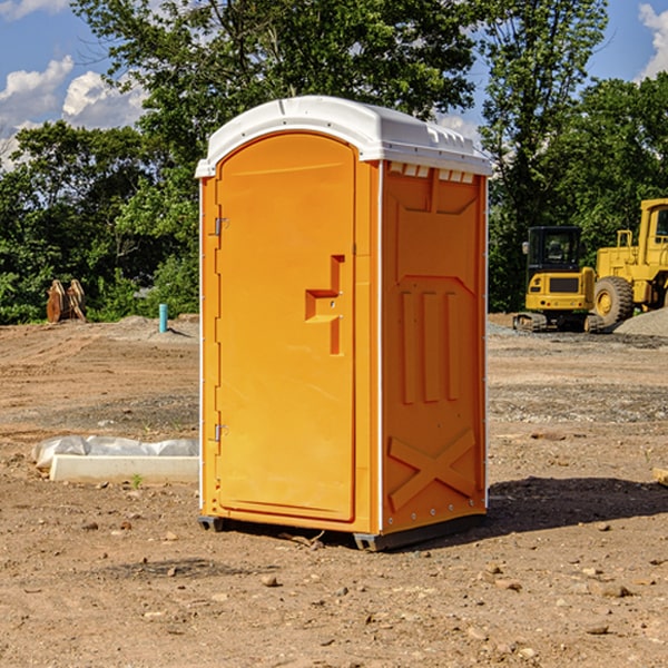 what is the cost difference between standard and deluxe portable restroom rentals in Rolland MI